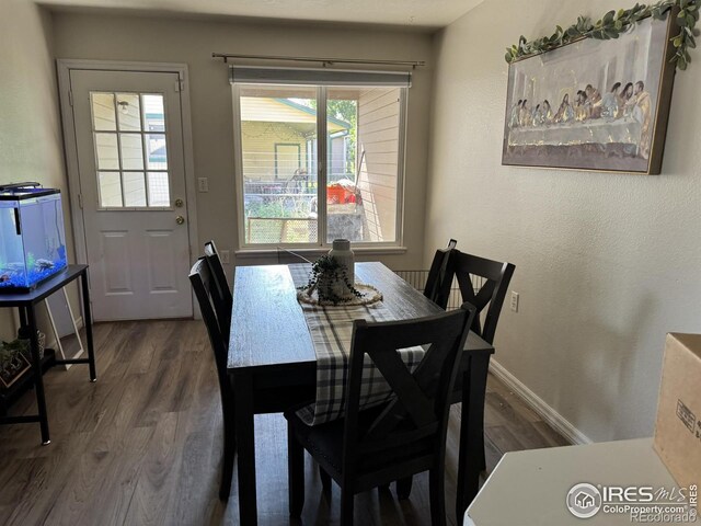 3315 W 35th St, Greeley, CO 80634 - dining space featuring wood finished floors and baseboards