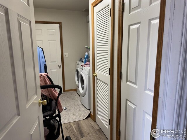 3315 W 35th St, Greeley, CO 80634 - laundry room featuring washing machine and clothes dryer and dark wood finished floors