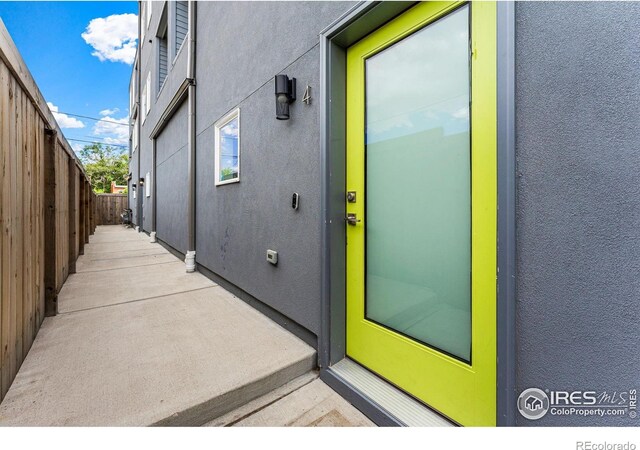 3450 N Downing St Unit 4, Denver, CO 80205 - property entrance featuring stucco siding