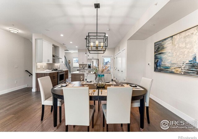 3450 N Downing St Unit 4, Denver, CO 80205 - dining room with dark wood finished floors, recessed lighting, and a chandelier