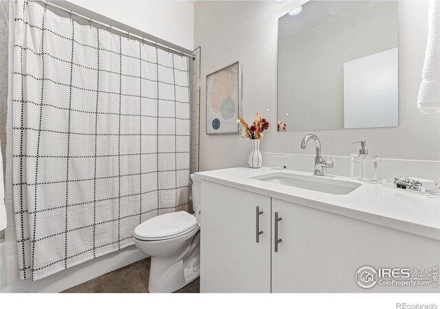 3450 N Downing St Unit 4, Denver, CO 80205 - full bathroom with vanity, curtained shower, and tile patterned floors