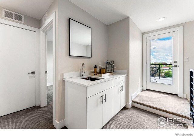 3450 N Downing St Unit 4, Denver, CO 80205 - indoor wet bar with light colored carpet and recessed lighting