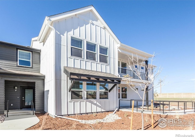 2714 Barnstormer St Unit G, Fort Collins, CO 80524 - view of front of house with a balcony and board and batten siding