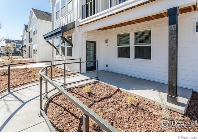 2714 Barnstormer St Unit G, Fort Collins, CO 80524 - doorway to property with a patio area, a balcony, and board and batten siding