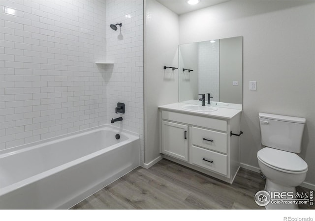 2714 Barnstormer St Unit G, Fort Collins, CO 80524 - full bathroom with wood finished floors, vanity, tub / shower combination, and recessed lighting