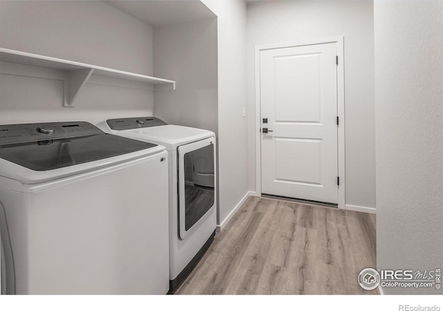 2714 Barnstormer St Unit G, Fort Collins, CO 80524 - laundry area featuring separate washer and dryer and light wood finished floors