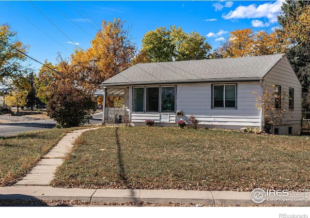 1109 Ironton St, Aurora, CO 80010 - view of front facade with a front yard and a shingled roof