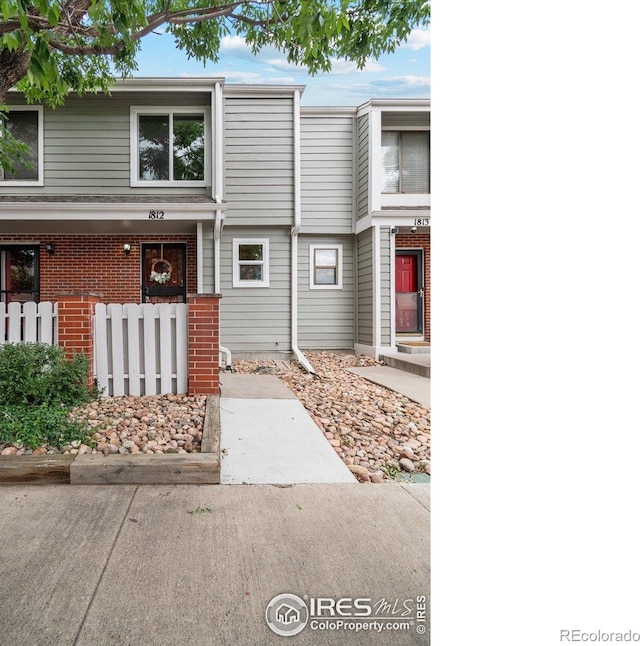 7474 E Arkansas Ave Unit 12, Denver, CO 80231 - view of property featuring brick siding