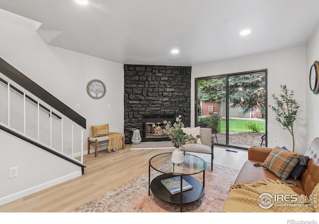 7474 E Arkansas Ave Unit 12, Denver, CO 80231 - living area with wood finished floors, stairs, a stone fireplace, and recessed lighting