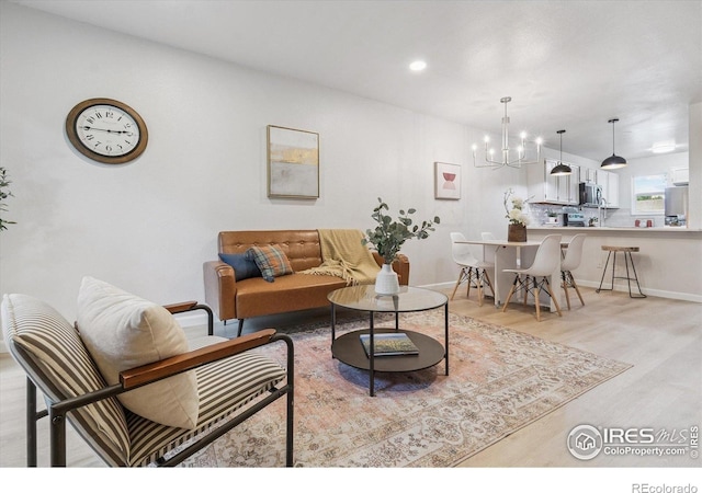 7474 E Arkansas Ave Unit 12, Denver, CO 80231 - living room featuring a chandelier, light wood-style floors, and recessed lighting