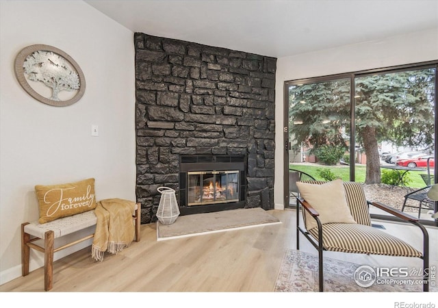 7474 E Arkansas Ave Unit 12, Denver, CO 80231 - living room with wood finished floors and a fireplace