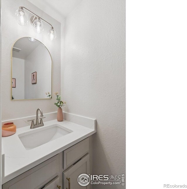 7474 E Arkansas Ave Unit 12, Denver, CO 80231 - bathroom featuring vanity