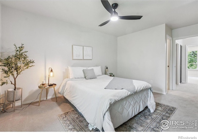 7474 E Arkansas Ave Unit 12, Denver, CO 80231 - carpeted bedroom featuring baseboards and a ceiling fan