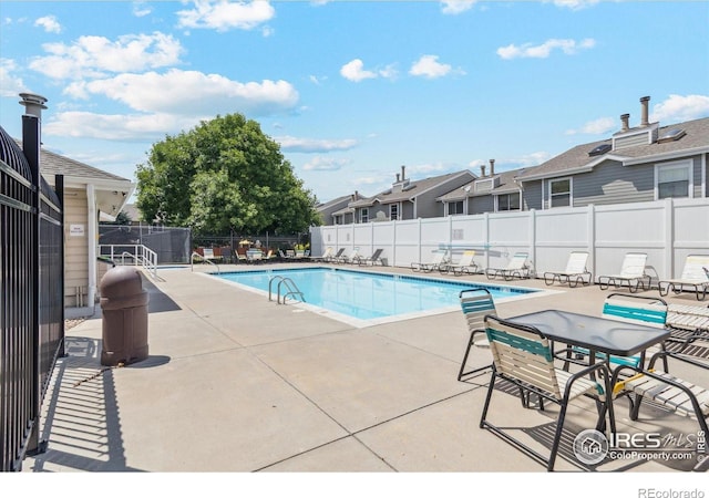 7474 E Arkansas Ave Unit 12, Denver, CO 80231 - community pool featuring a patio and a residential view