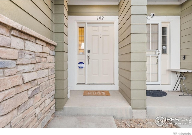 3000 E 112th Ave Unit 102, Northglenn, CO 80233 - view of exterior entry with a surveillance system