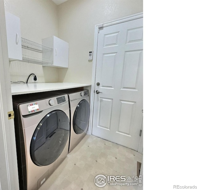 3000 E 112th Ave Unit 102, Northglenn, CO 80233 - laundry room with washer and dryer and light flooring