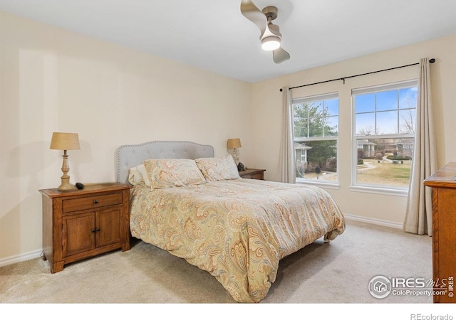 3000 E 112th Ave Unit 102, Northglenn, CO 80233 - bedroom featuring light carpet and ceiling fan