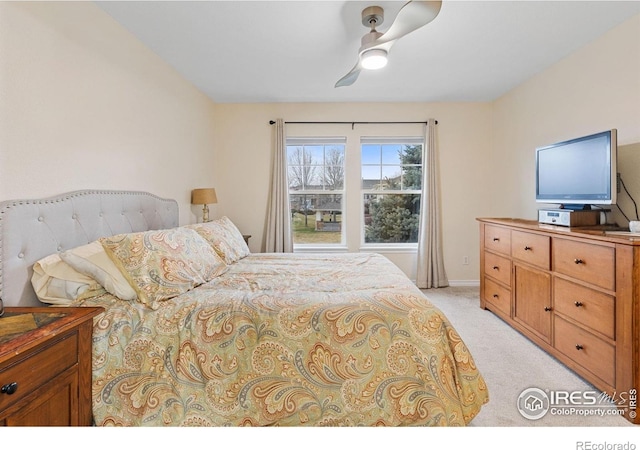 3000 E 112th Ave Unit 102, Northglenn, CO 80233 - bedroom featuring light carpet and ceiling fan