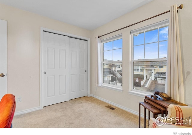 3000 E 112th Ave Unit 102, Northglenn, CO 80233 - carpeted bedroom featuring baseboards and a closet