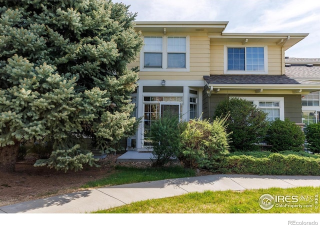 3000 E 112th Ave Unit 102, Northglenn, CO 80233 - view of front of property with a shingled roof
