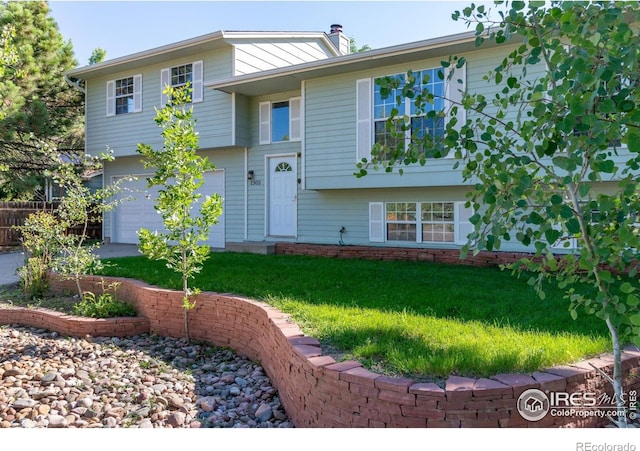 1305 Inverness Dr, Lafayette, CO 80026 - view of front of house featuring a front lawn, an attached garage, and a chimney