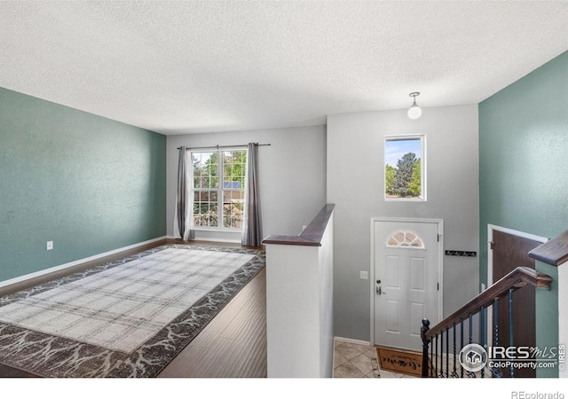 1305 Inverness Dr, Lafayette, CO 80026 - entryway with a textured ceiling and baseboards