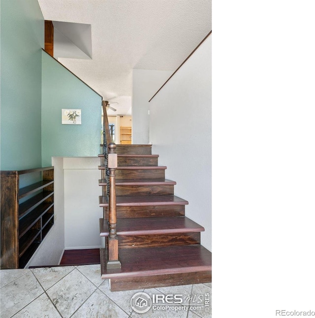 1305 Inverness Dr, Lafayette, CO 80026 - stairway with tile patterned floors and ceiling fan