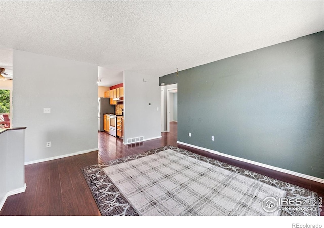 1305 Inverness Dr, Lafayette, CO 80026 - spare room featuring dark wood-style floors and a textured ceiling