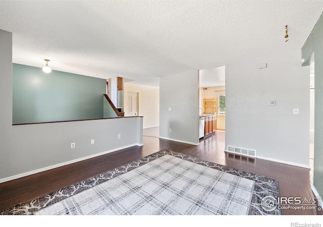 1305 Inverness Dr, Lafayette, CO 80026 - spare room featuring wood finished floors and a textured ceiling