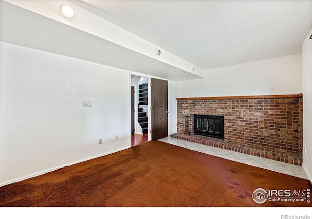 1305 Inverness Dr, Lafayette, CO 80026 - unfurnished living room featuring carpet, tile patterned flooring, a fireplace, and stairs
