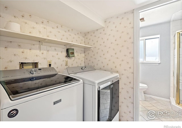 1305 Inverness Dr, Lafayette, CO 80026 - laundry room with separate washer and dryer, light tile patterned flooring, and wallpapered walls