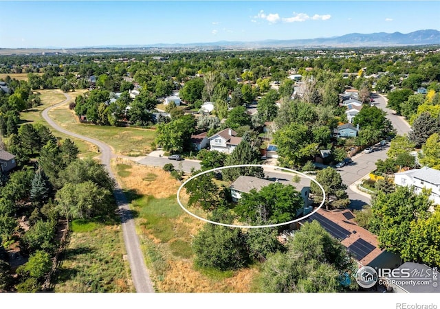 1305 Inverness Dr, Lafayette, CO 80026 - aerial perspective of suburban area with a mountain backdrop