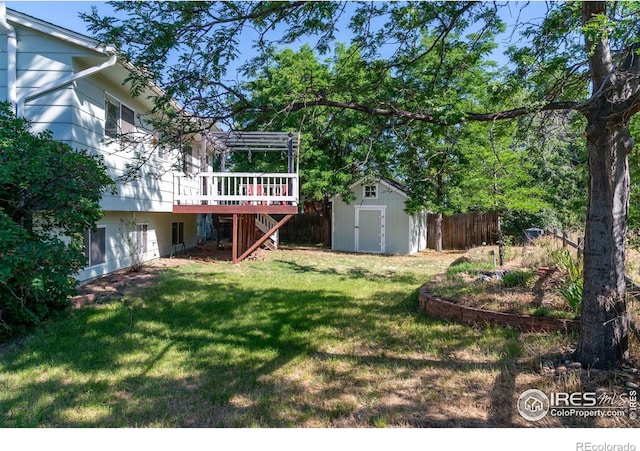 1305 Inverness Dr, Lafayette, CO 80026 - view of yard featuring a storage unit and a wooden deck