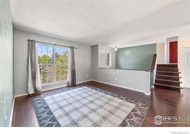 1305 Inverness Dr, Lafayette, CO 80026 - empty room with wood finished floors and a textured ceiling