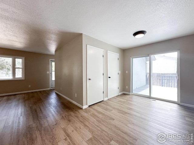11941 S Clayson St, Parker, CO 80138 - unfurnished room featuring a textured ceiling and wood finished floors