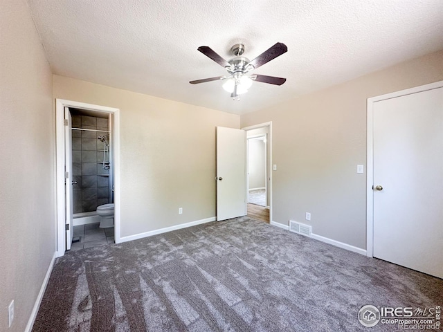 11941 S Clayson St, Parker, CO 80138 - unfurnished bedroom with carpet floors, a textured ceiling, a ceiling fan, and ensuite bath