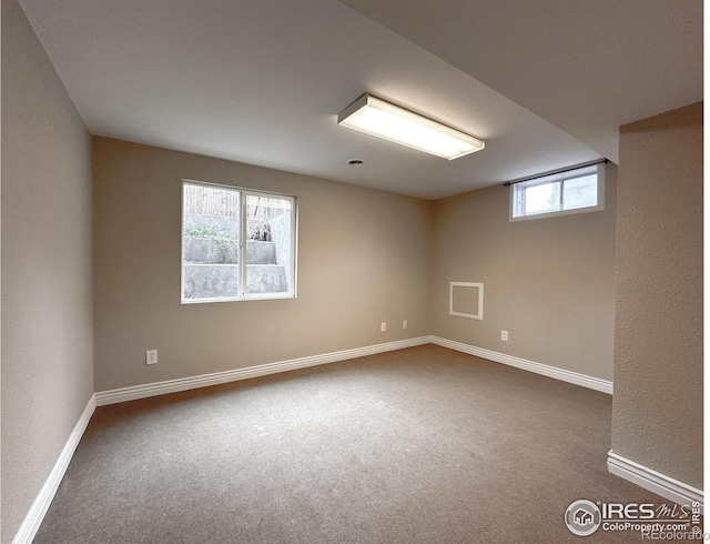 11941 S Clayson St, Parker, CO 80138 - spare room featuring dark colored carpet and baseboards