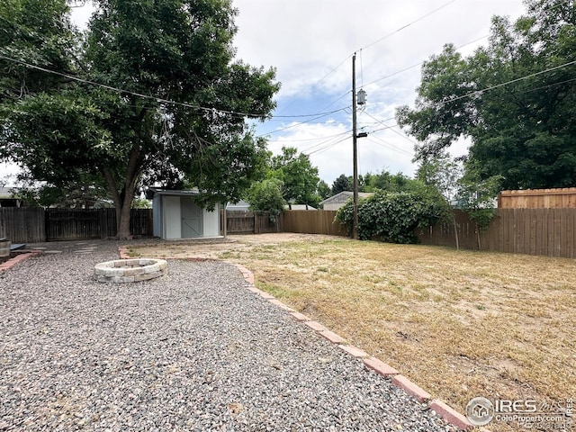 11941 S Clayson St, Parker, CO 80138 - fenced backyard with a fire pit and a storage unit