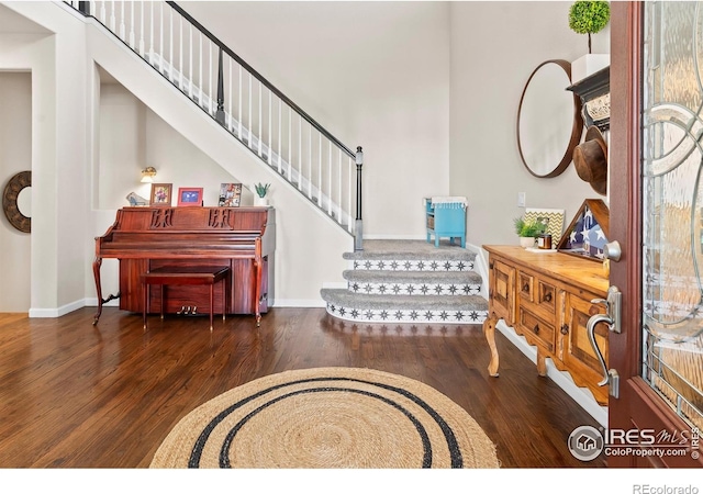 23570 E Holly Hills Way, Parker, CO 80138 - entryway featuring wood finished floors and stairway