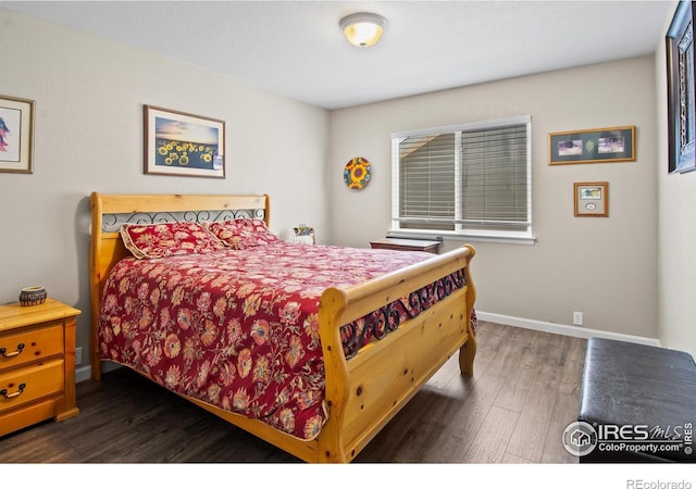 23570 E Holly Hills Way, Parker, CO 80138 - bedroom featuring dark wood-type flooring and baseboards