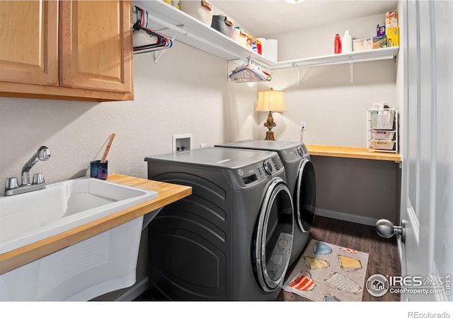 23570 E Holly Hills Way, Parker, CO 80138 - laundry room featuring cabinet space, washing machine and clothes dryer, and wood finished floors