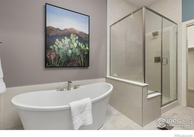 750 Kubat Ln Unit B, Longmont, CO 80503 - full bath with a shower stall, a freestanding tub, and tile patterned floors