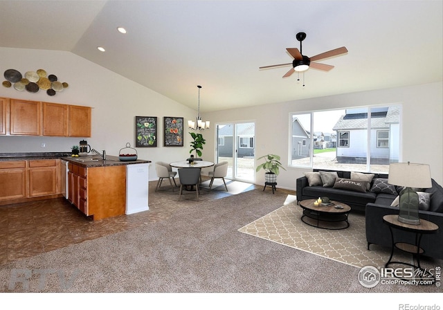 625 87th Ave, Greeley, CO 80634 - kitchen with lofted ceiling, open floor plan, a ceiling fan, a chandelier, and brown cabinetry
