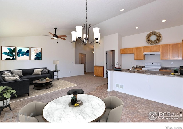 625 87th Ave, Greeley, CO 80634 - dining room with a ceiling fan, a chandelier, recessed lighting, light carpet, and high vaulted ceiling