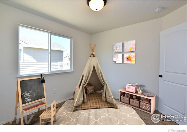 625 87th Ave, Greeley, CO 80634 - rec room featuring baseboards and carpet flooring