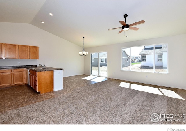 625 87th Ave, Greeley, CO 80634 - kitchen featuring vaulted ceiling, a chandelier, a peninsula, a ceiling fan, and brown cabinetry