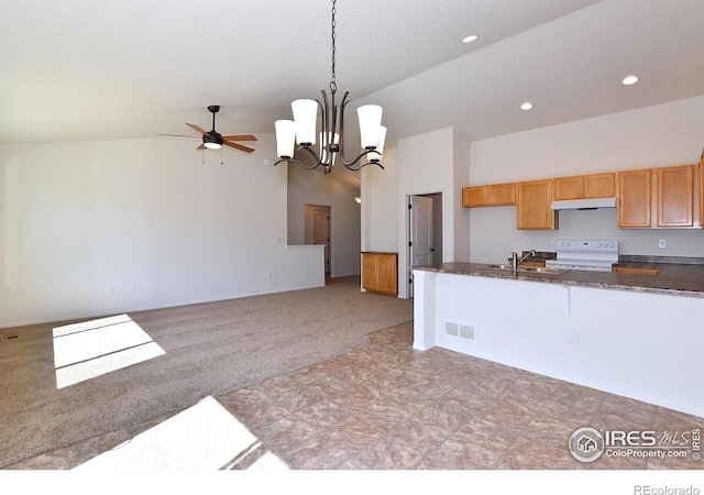 625 87th Ave, Greeley, CO 80634 - kitchen with white range with electric cooktop, under cabinet range hood, ceiling fan, light carpet, and a chandelier