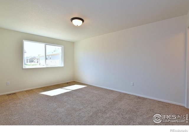 625 87th Ave, Greeley, CO 80634 - spare room featuring carpet floors and baseboards