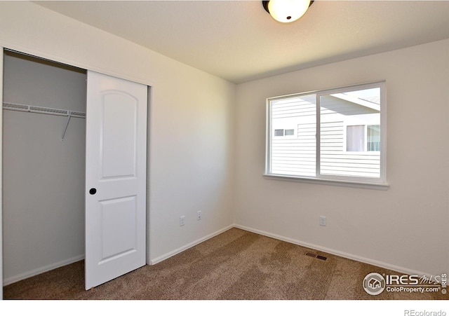 625 87th Ave, Greeley, CO 80634 - unfurnished bedroom featuring carpet and a closet