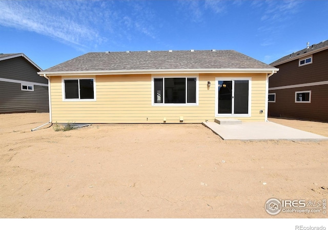625 87th Ave, Greeley, CO 80634 - back of house featuring a patio area and roof with shingles